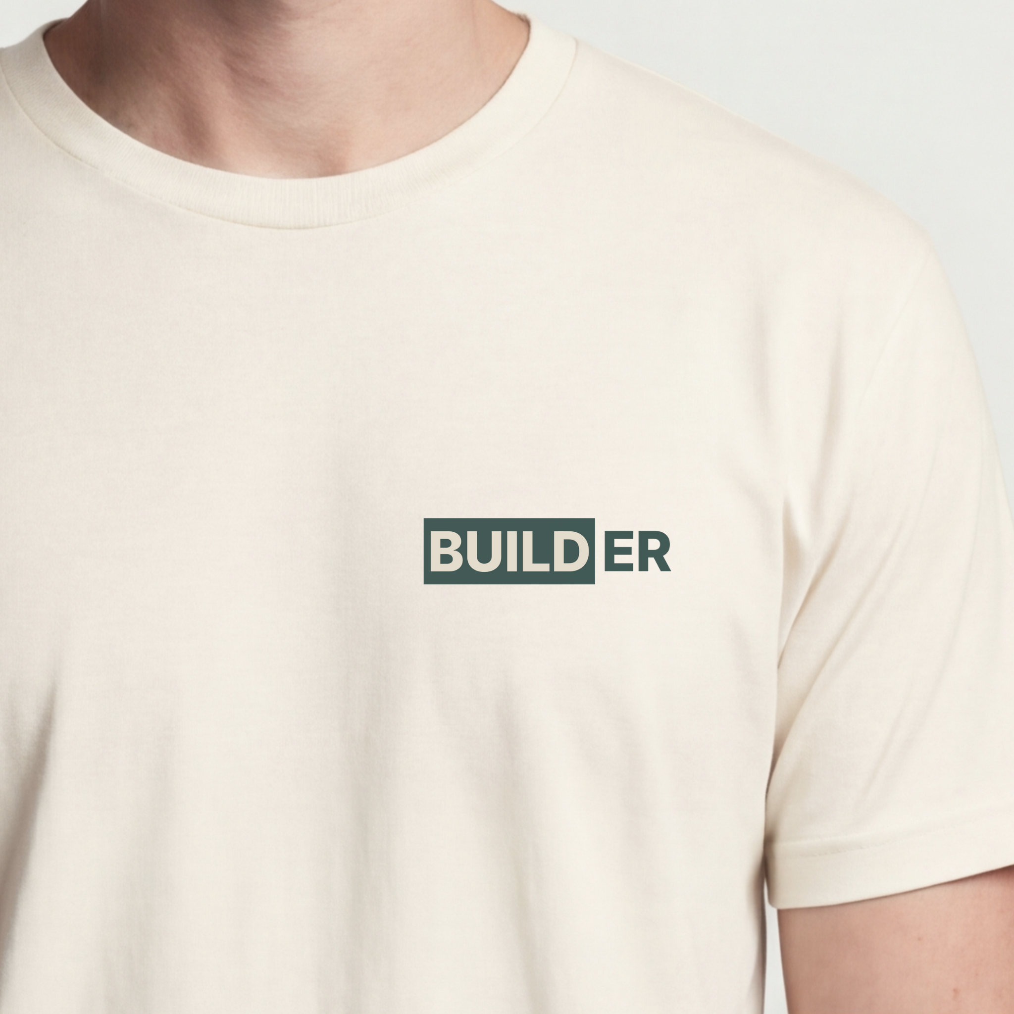 Founder Threads | Builder Technical Tee - Natural Bone - Hero Crop. Minimalist typography for software engineers and founders.