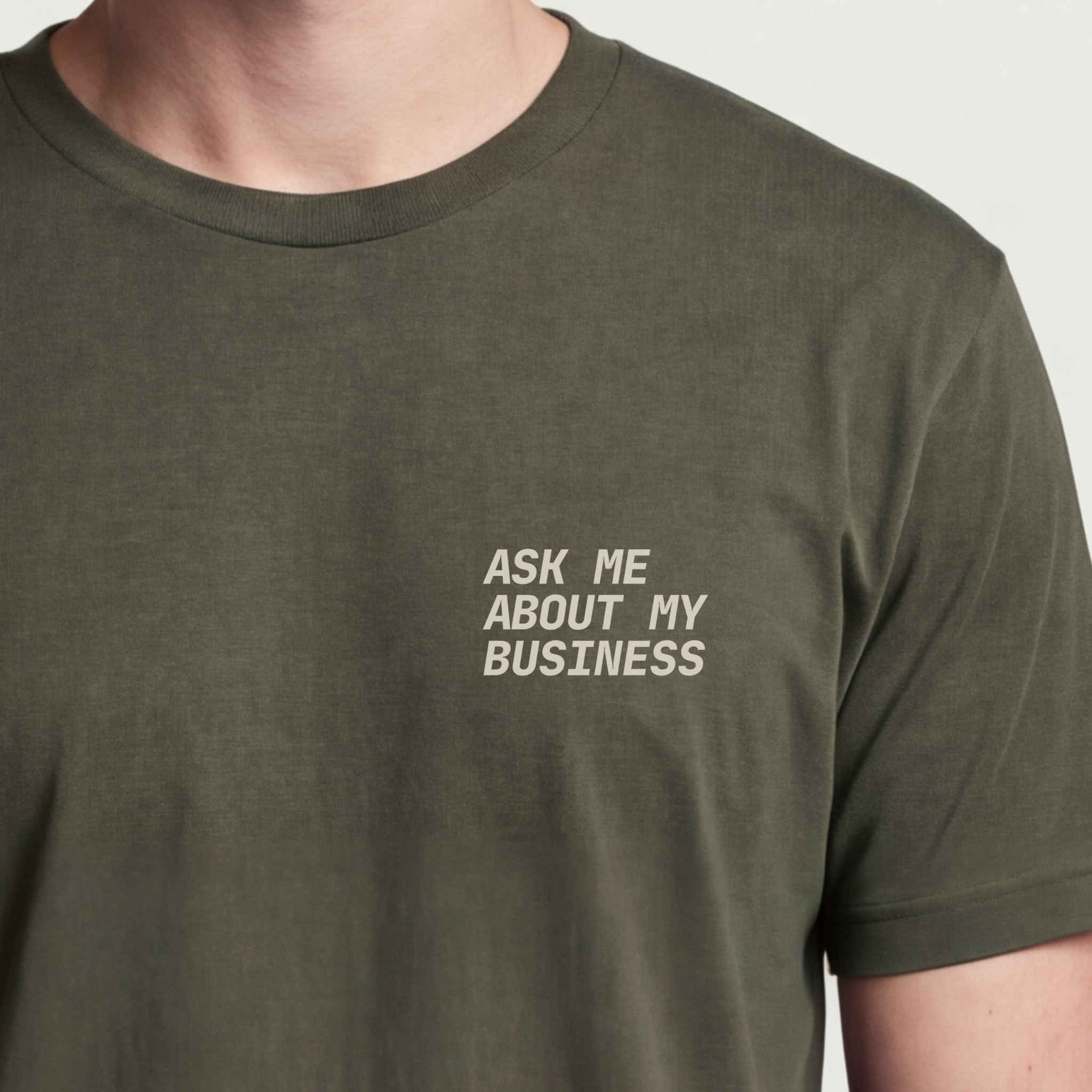 Founder Threads | Ask Me About My Business Tee - Builder CTA Uniform - Military Olive - Hero Crop. Physical call-to-action for real life gear.
