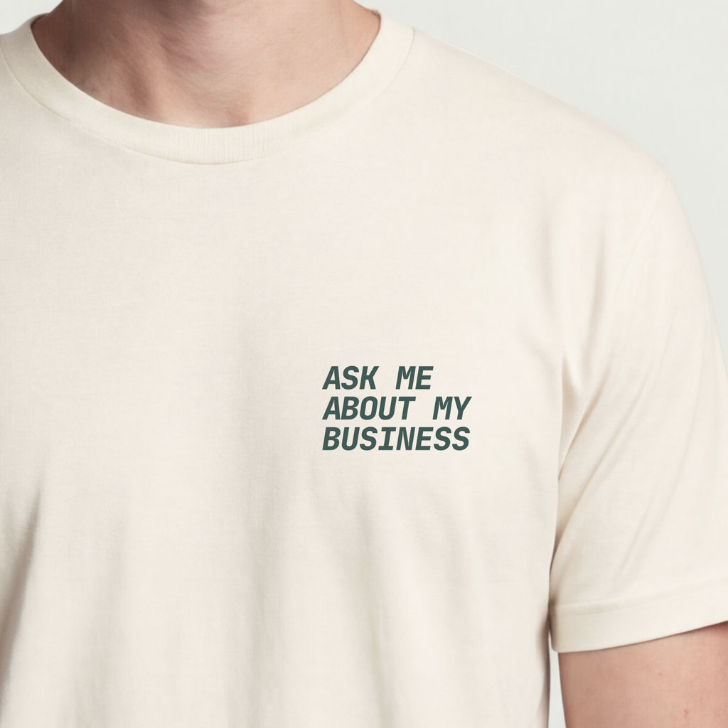Founder Threads | Ask Me About My Business Technical Tee - Natural Bone - Hero Crop. Minimalist typography for engineers and founders.