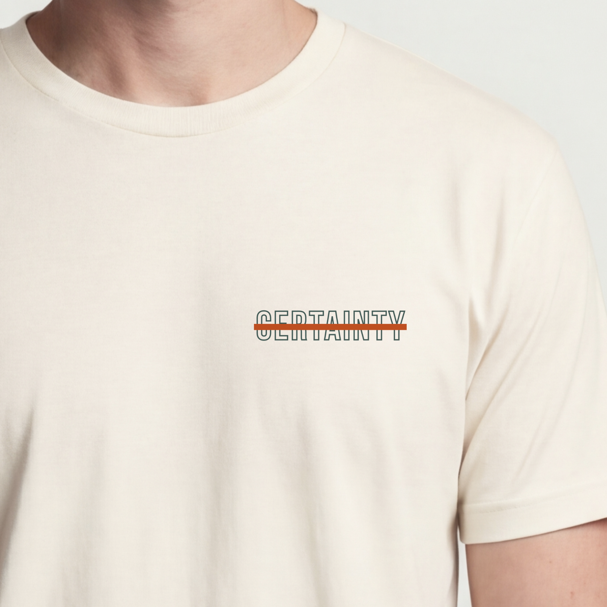 Founder Threads | Certainty Strikethrough Technical Tee. Natural Bone design for software engineers and PMs. Hero crop view.