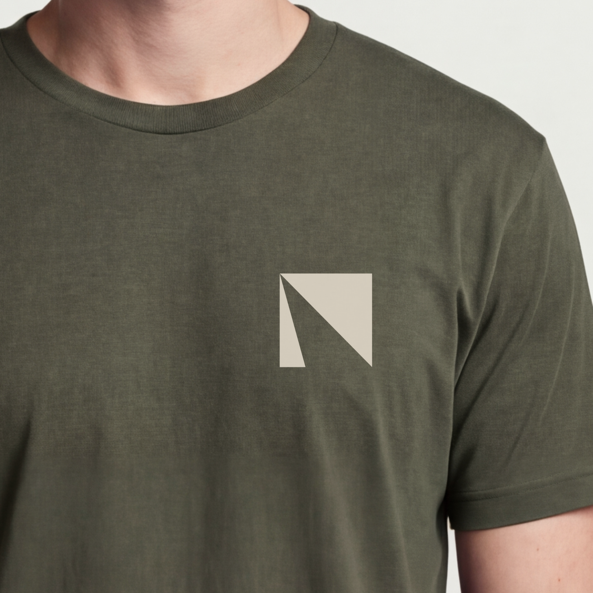 Founder Threads | Delta Tee. Military Olive product builder uniform. Symbolic minimalist tech design. Hero crop view.
