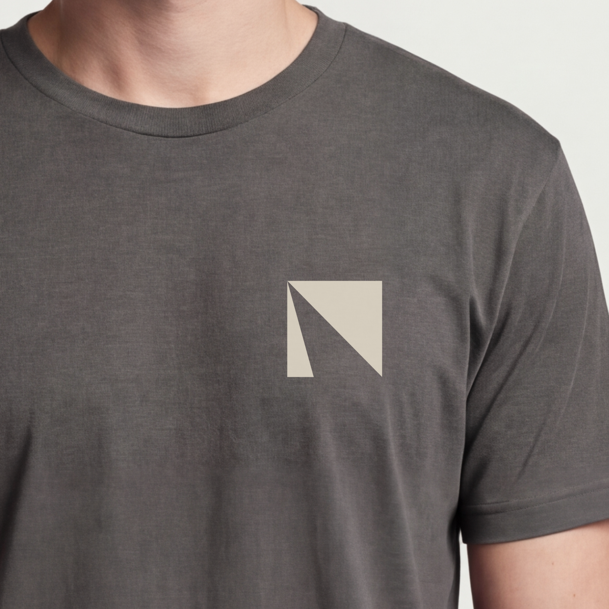 Founder Threads | Delta Tee. Asphalt Grey startup builder gear. Representing the logic of change. Hero crop detail.