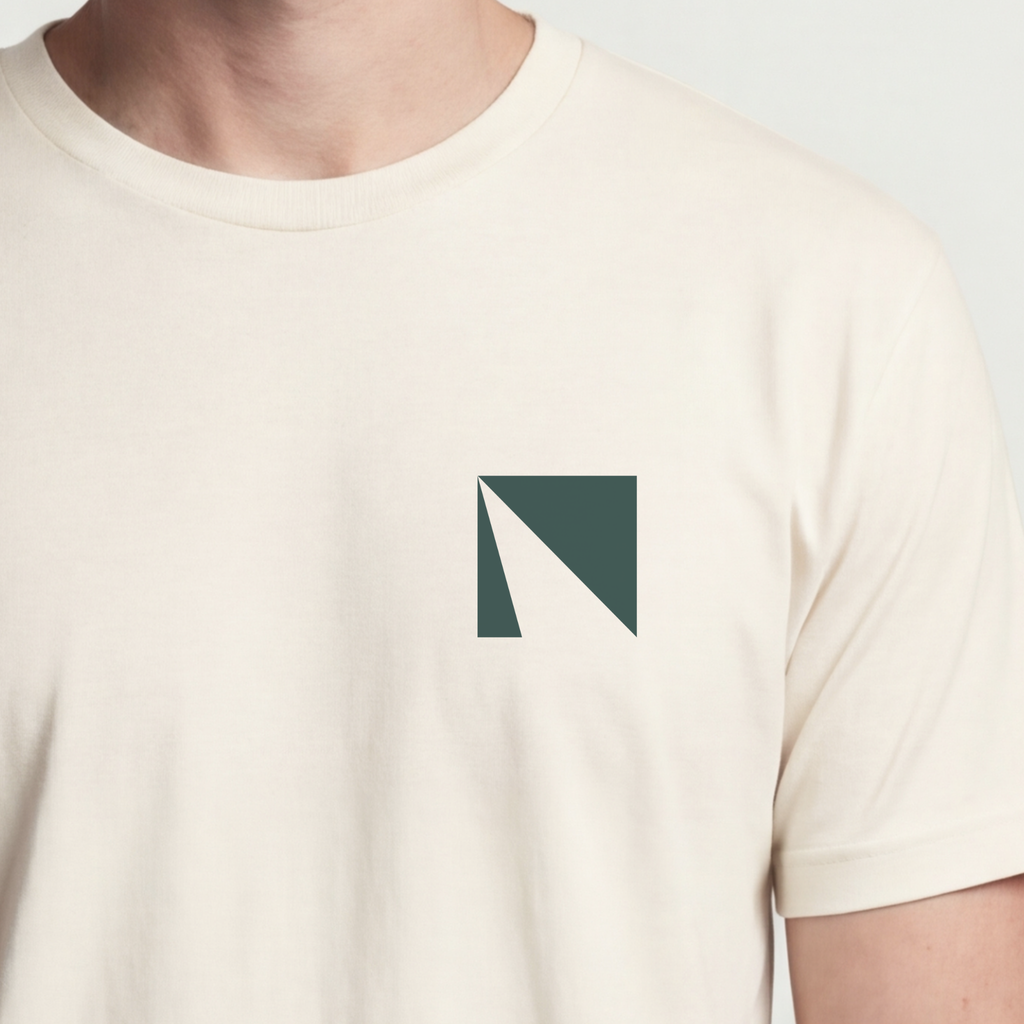 Founder Threads | Delta Technical Tee. Natural Bone minimalist symbol for engineering founders. Hero crop view.