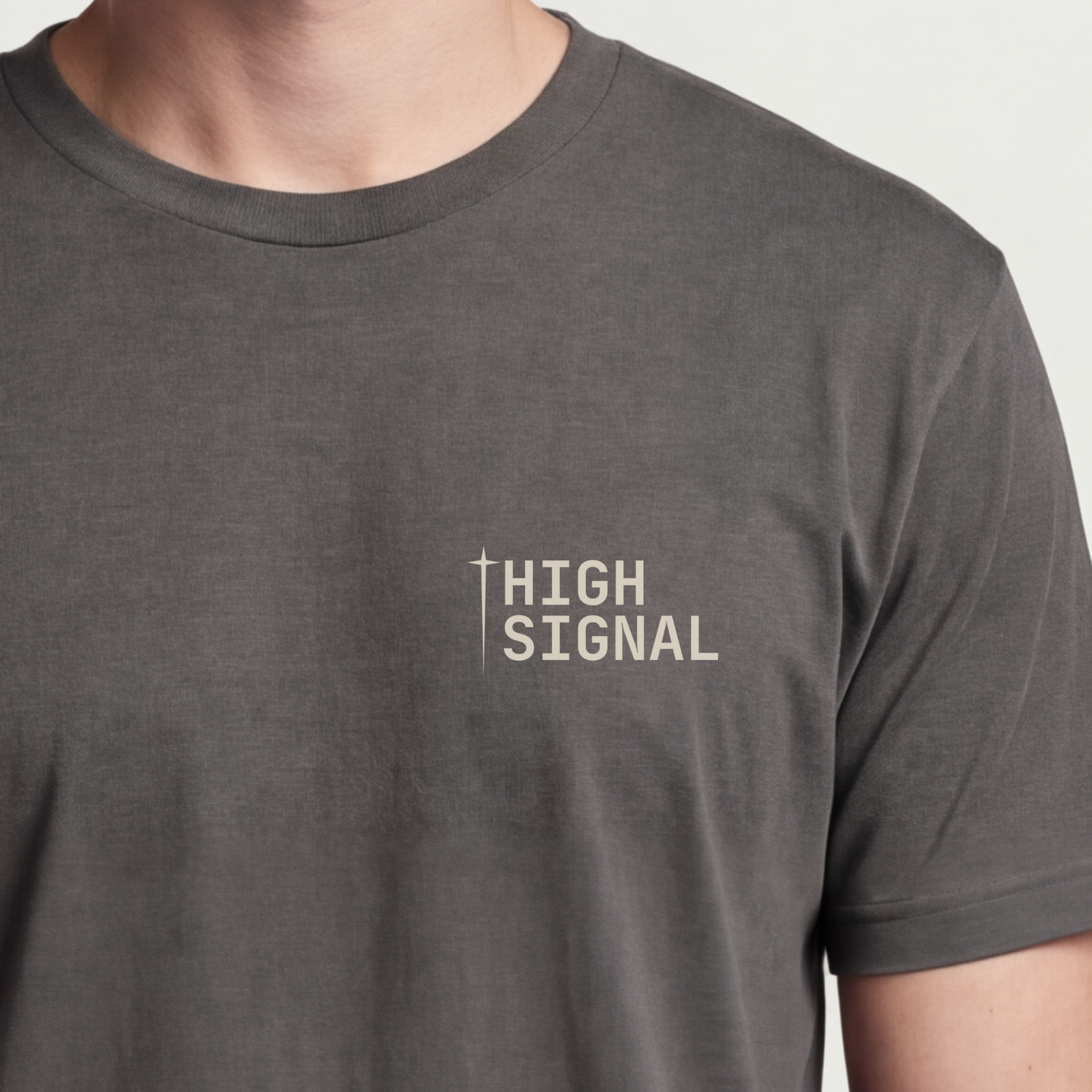 Founder Threads | High Signal Tee. Asphalt Grey startup builder gear. Clarity over noise manifesto. Hero crop detail.