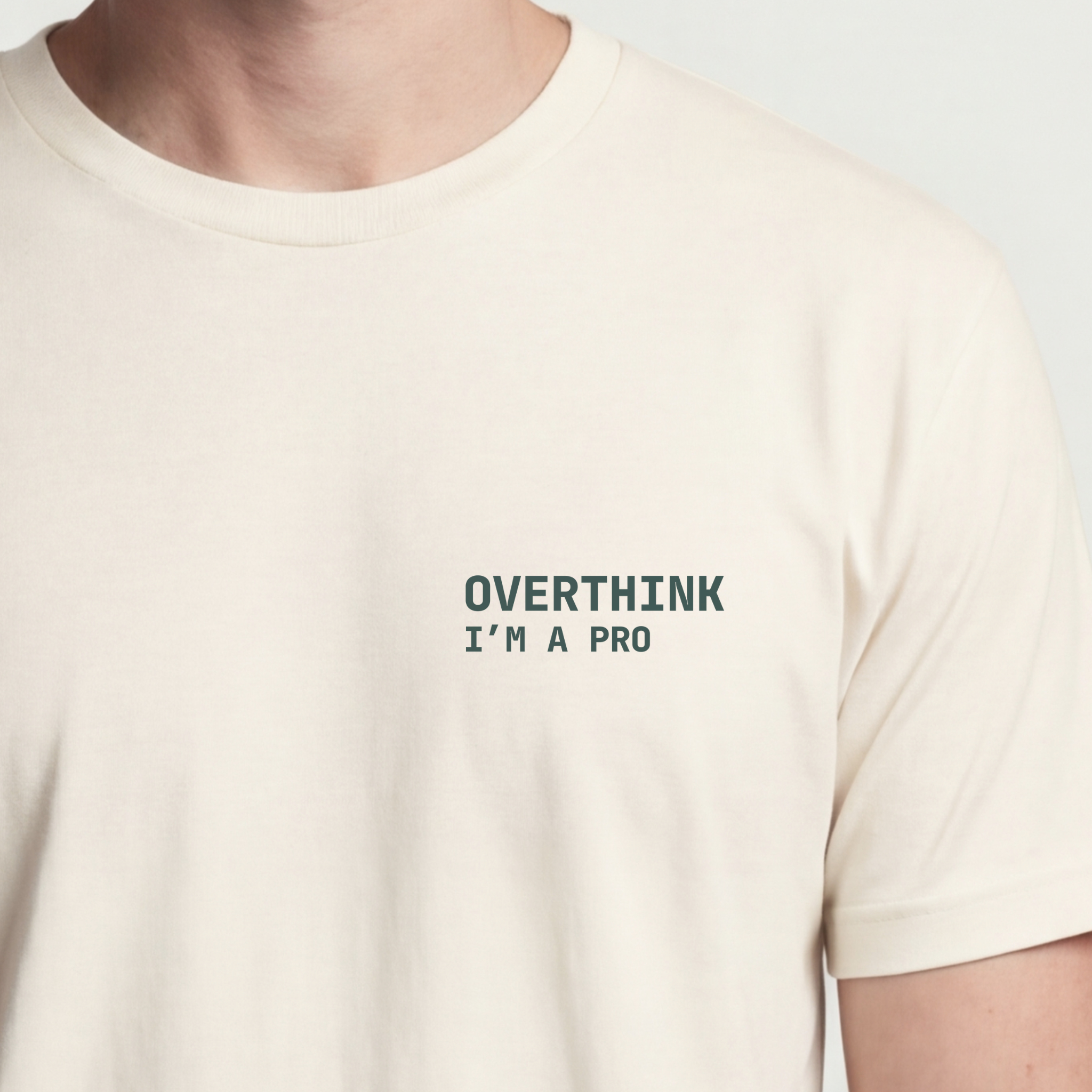 Founder Threads | Overthink Pro Technical Tee. Natural Bone minimalist design for data scientists and PMs. Hero crop view.