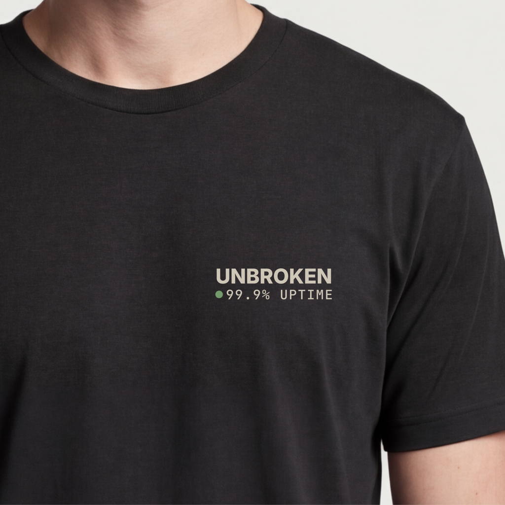 Founder Threads | Unbroken Tee - 99.9% Uptime Resilience - System Black - Hero Crop. Gift for tech founders and devops engineers.